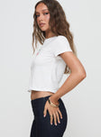 side view of model wearing Princess Polly Three's A Charm Top White Short Sleeves Crew Neck 