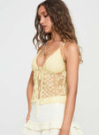 side view of model wearing Princess Polly CHANTRIA LACE TOP YELLOW Sleeveless Plunger 