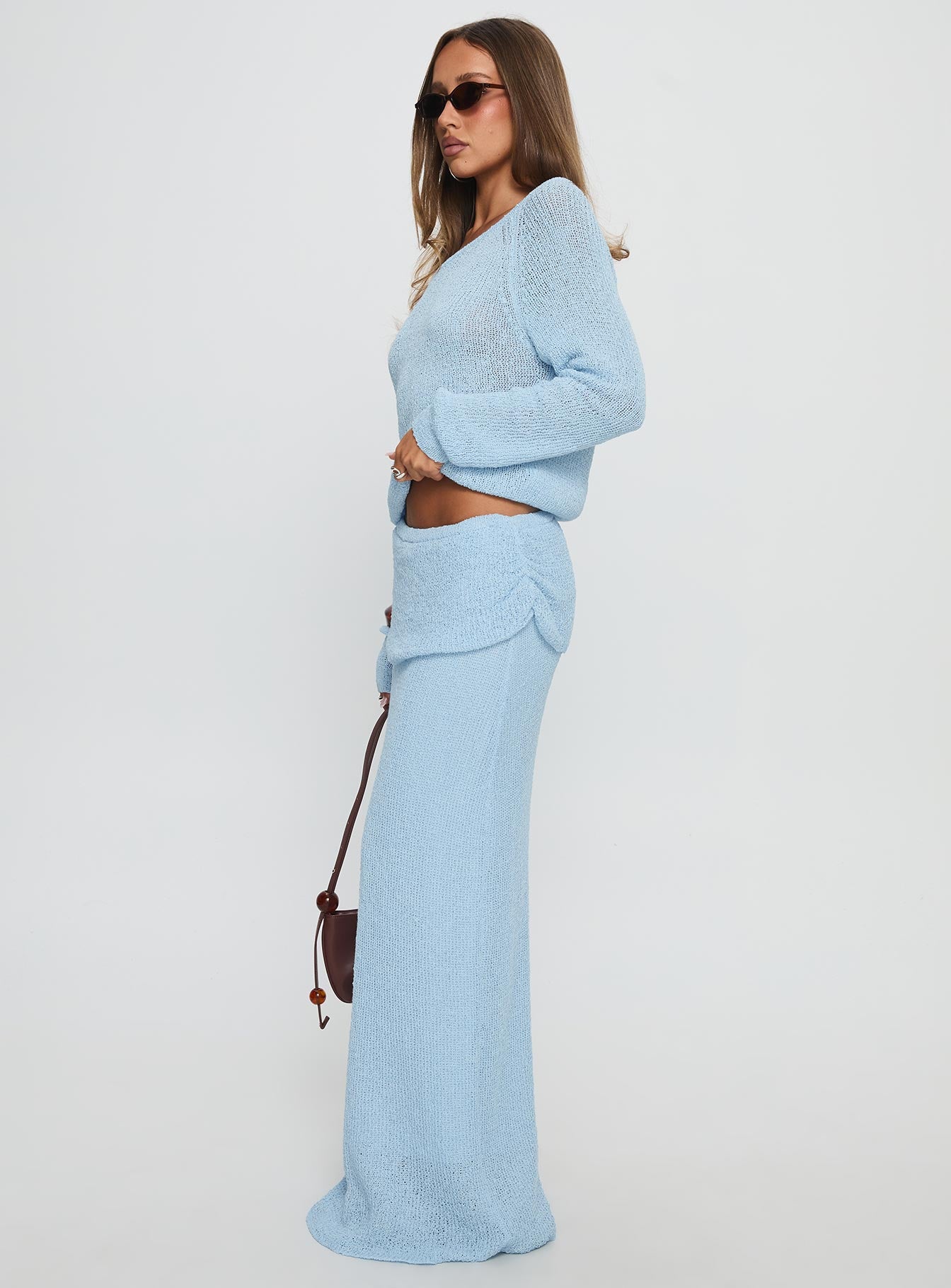   side view of model wearing Princess Polly Tessira Boucle Maxi Skirt Blue Maxi 