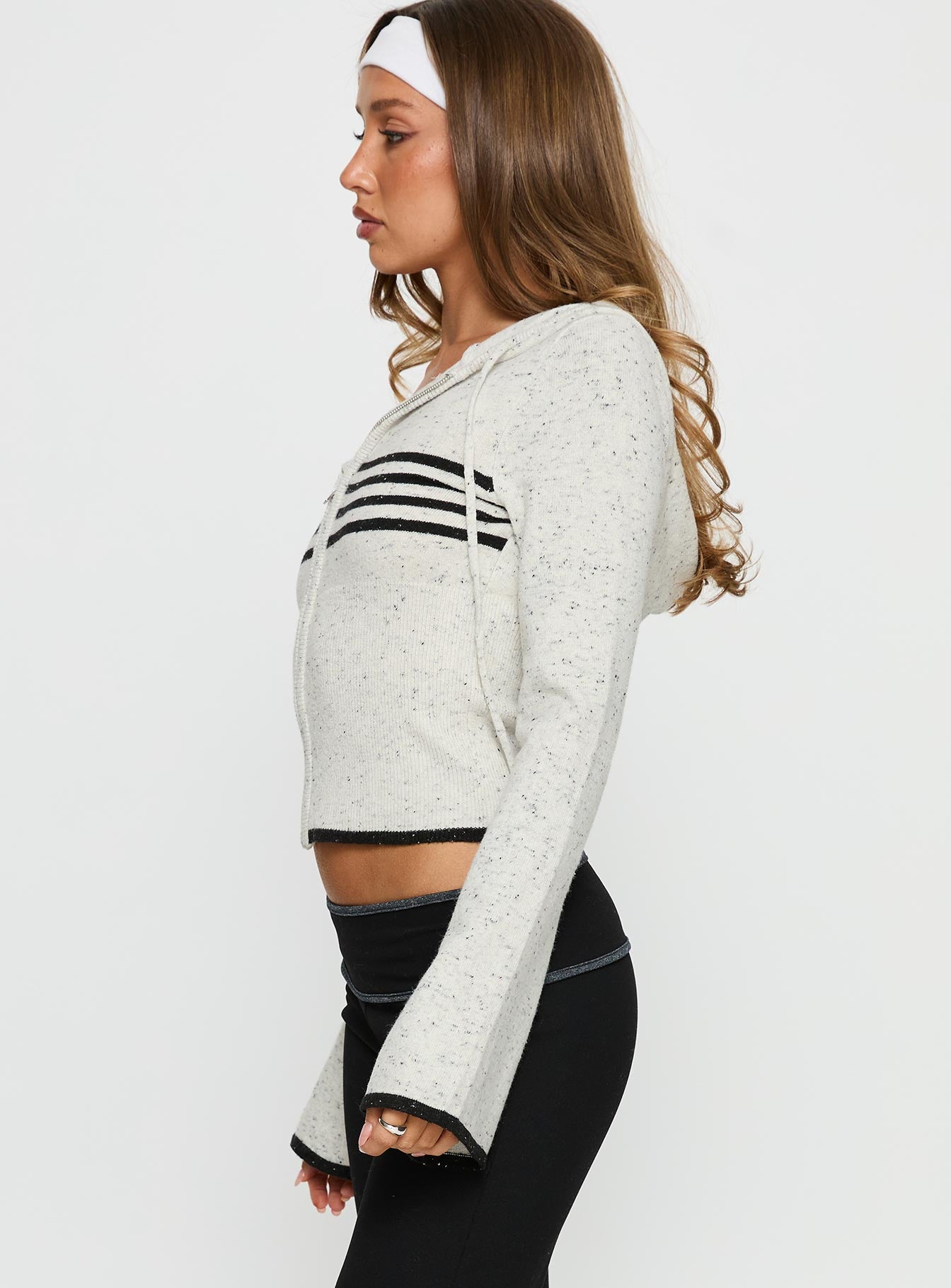 side view of model wearing Princess Polly Brandea Zip Through Knit Hoodie White Marle Cropped 