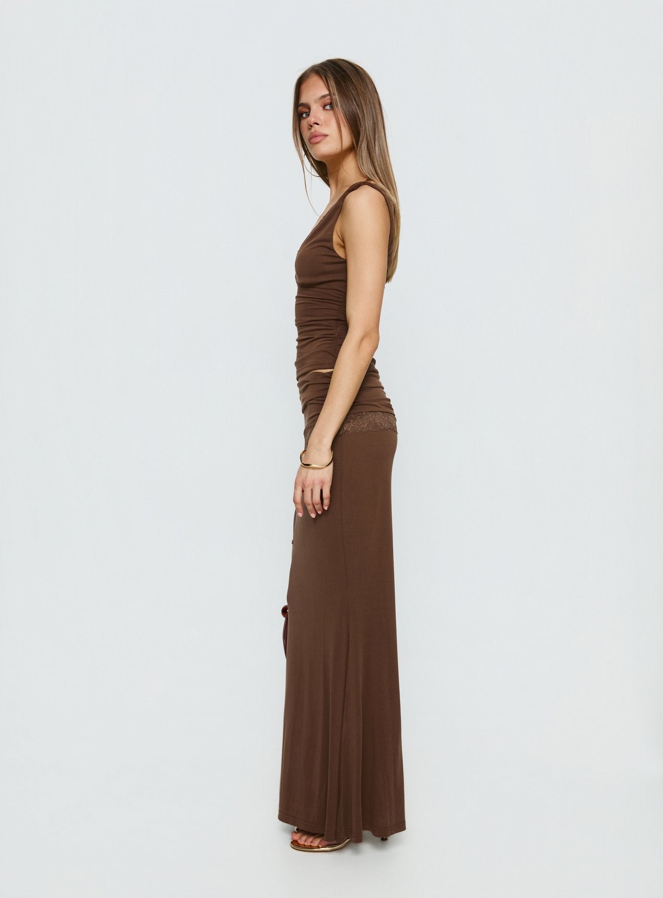   side view of model wearing Princess Polly Zespri Jersey Maxi Skirt Brown Maxi Skirts 