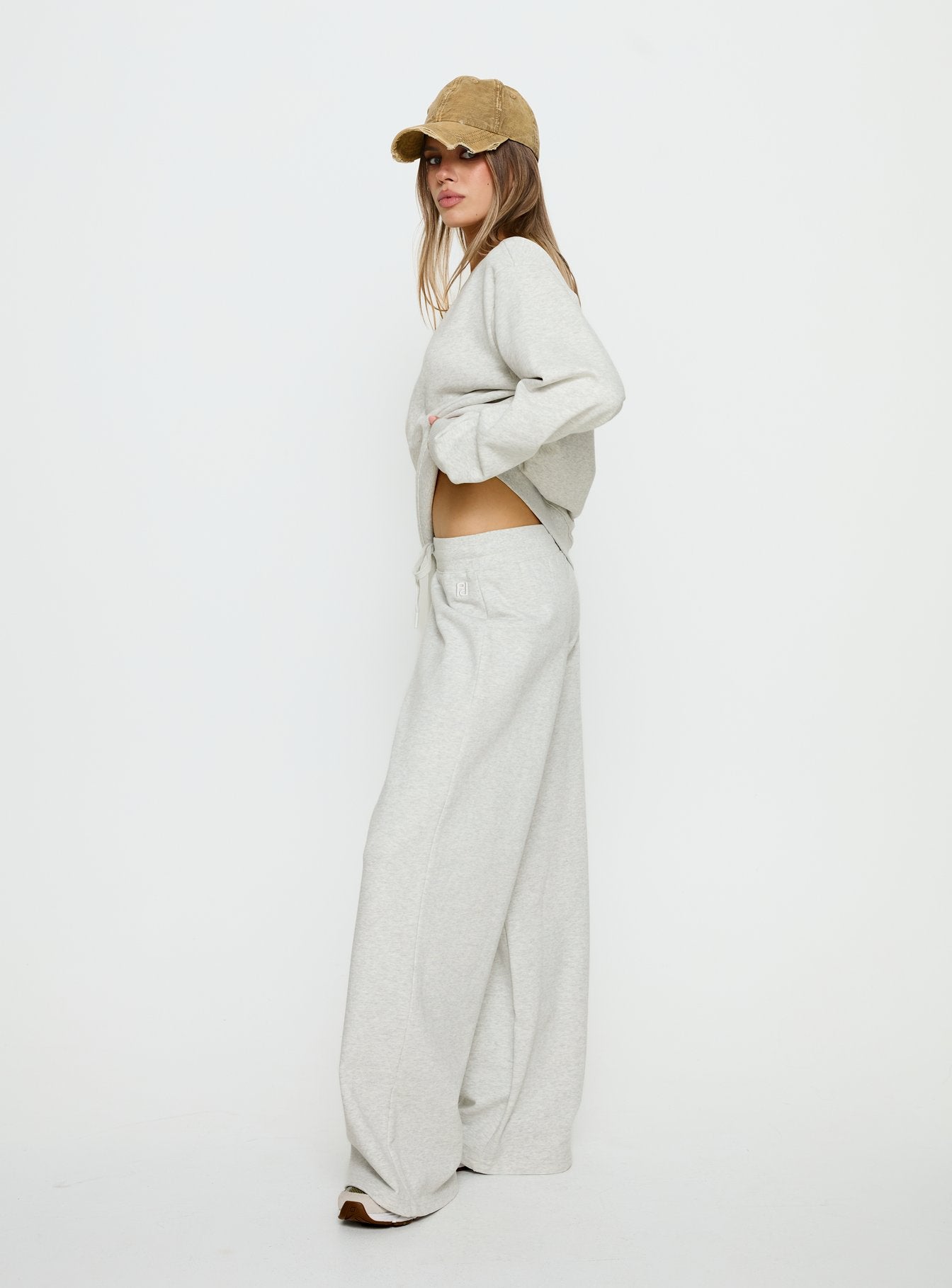side view of model wearing Princess Polly Dodie Wide Leg Pants Grey Marle Mid Rise Pants 