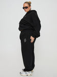 Black Track pants Relaxed fit, elasticated waist and cuffs, twin hip pockets