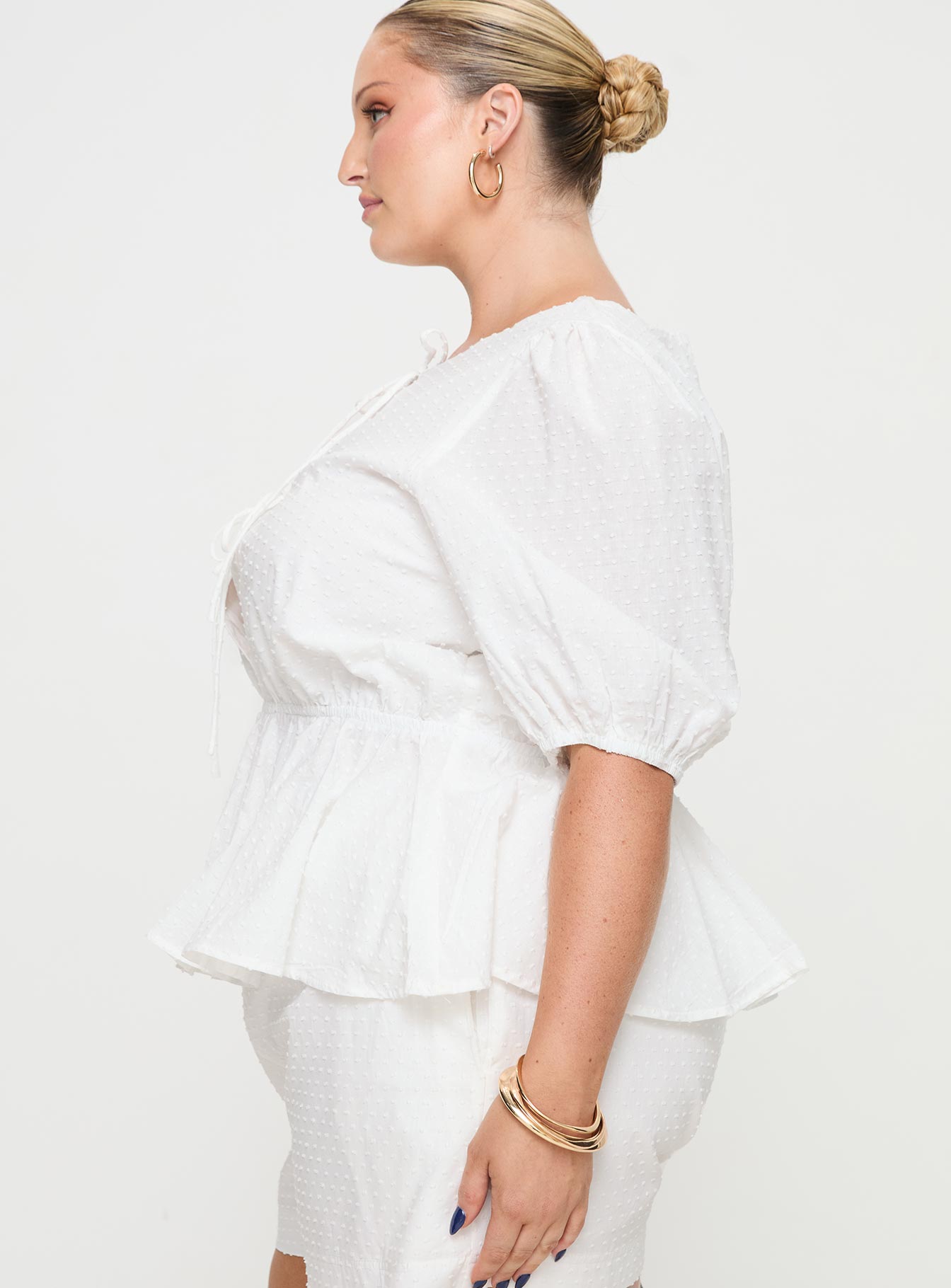 side view of model wearing Princess Polly Puff Puff Peplum Top White Curve Half Sleeves Crew Neck 