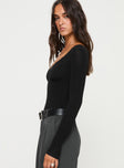 side view of model wearing Princess Polly Loveydove Bodysuit Black Tall Full Sleeves 