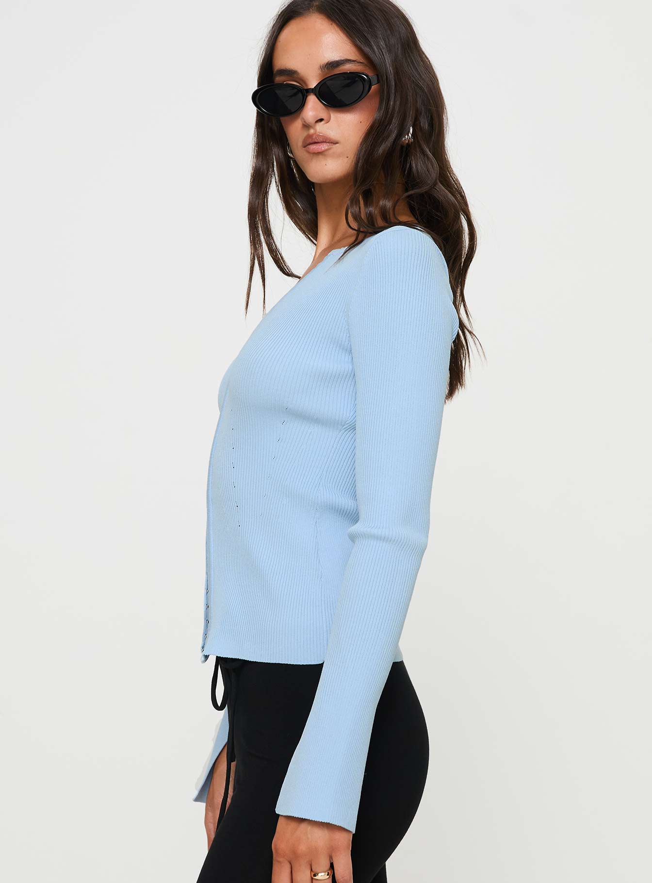 side view of model wearing Princess Polly Selections Long Sleeve Top Blue Full Sleeves V-Neck 