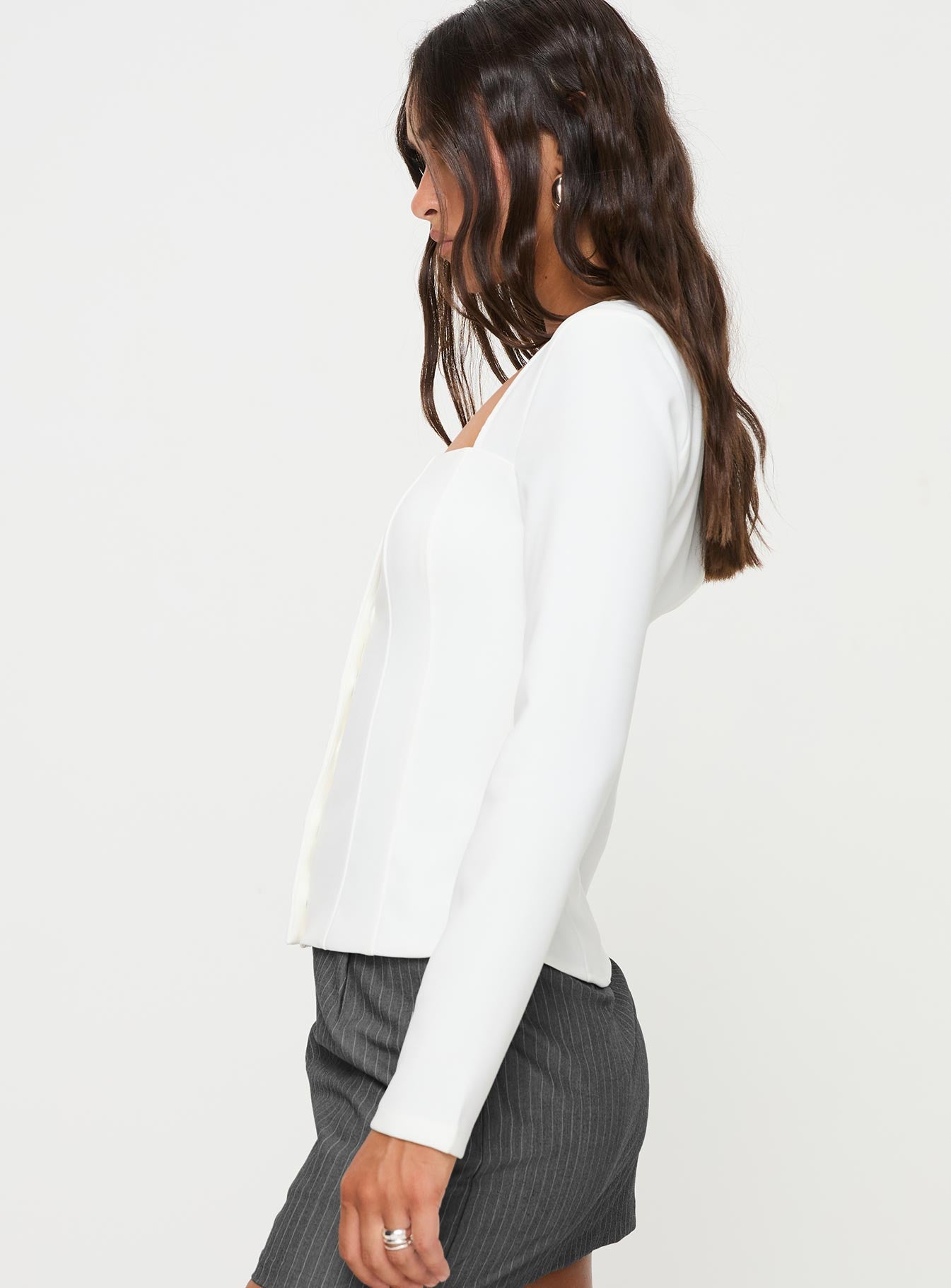 side view of model wearing Princess Polly Gaskin Long Sleeve Top White Full Sleeves Square Neck 