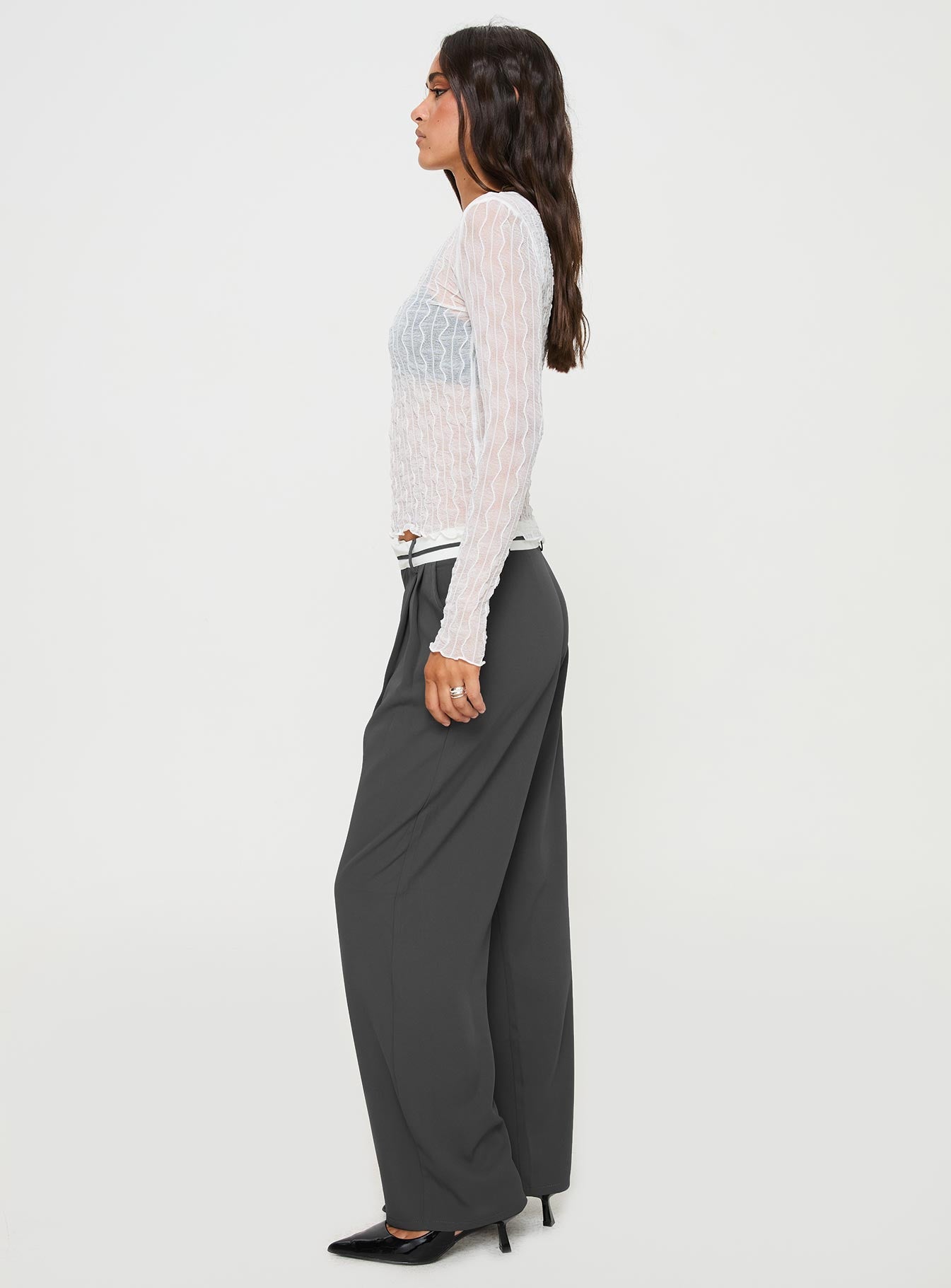 side view of model wearing Princess Polly Tennent Low Waist Pants Slate Mid Rise 
