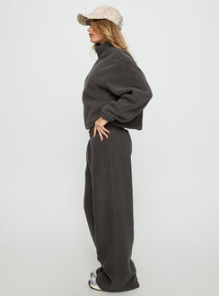 side view of model wearing Princess Polly Siberia Fleece Track Pant Charcoal Mid Rise Pants 