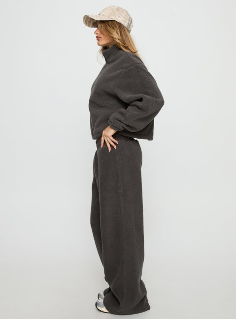 side view of model wearing Princess Polly Siberia Fleece Track Pant Charcoal Mid Rise Pants 