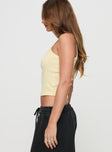 side view of model wearing Princess Polly Dept 97 Top Yellow Sleeveless Square Neck 