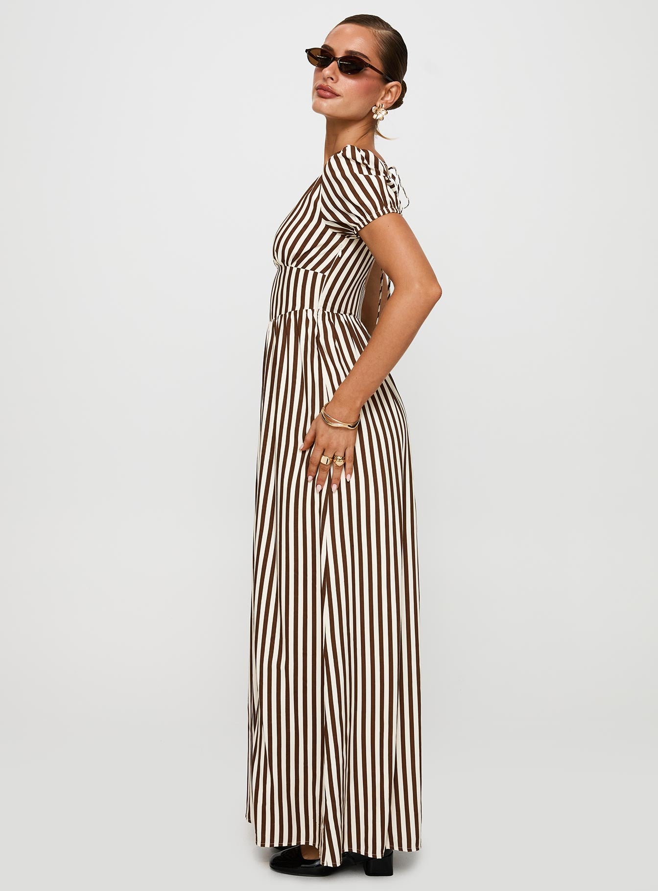 side view of model wearing Princess Polly Collyns Maxi Dress Beige Pinstripe V-Neck 