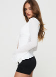 side view of model wearing Princess Polly Lucky Stars Knit Top Cream Full Sleeves Plunger 