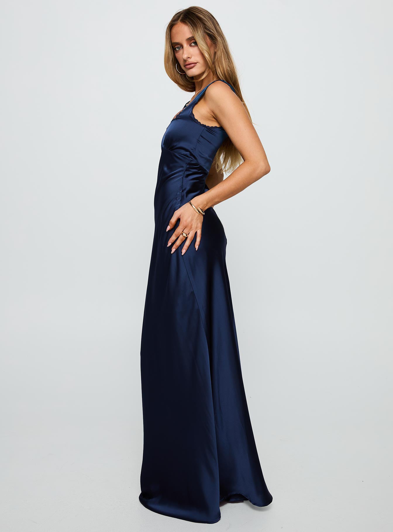 side view of model wearing Princess Polly Dasha Satin Maxi Dress Navy Square Neck 