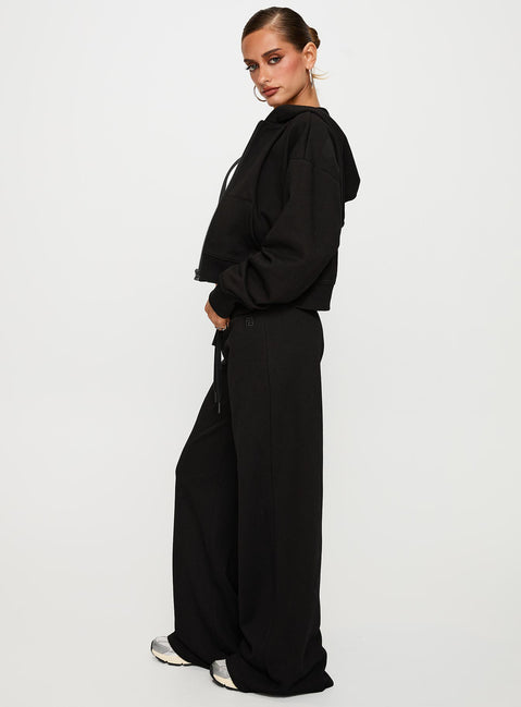 side view of model wearing Princess Polly Mindful Low Rise Pant Black Low Rise Pants 