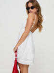 side view of model wearing Princess Polly Mahony Mini Dress White V-Neck 