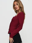 side view of model wearing Princess Polly Gaskin Long Sleeve Top Burgundy Full Sleeves Square Neck 