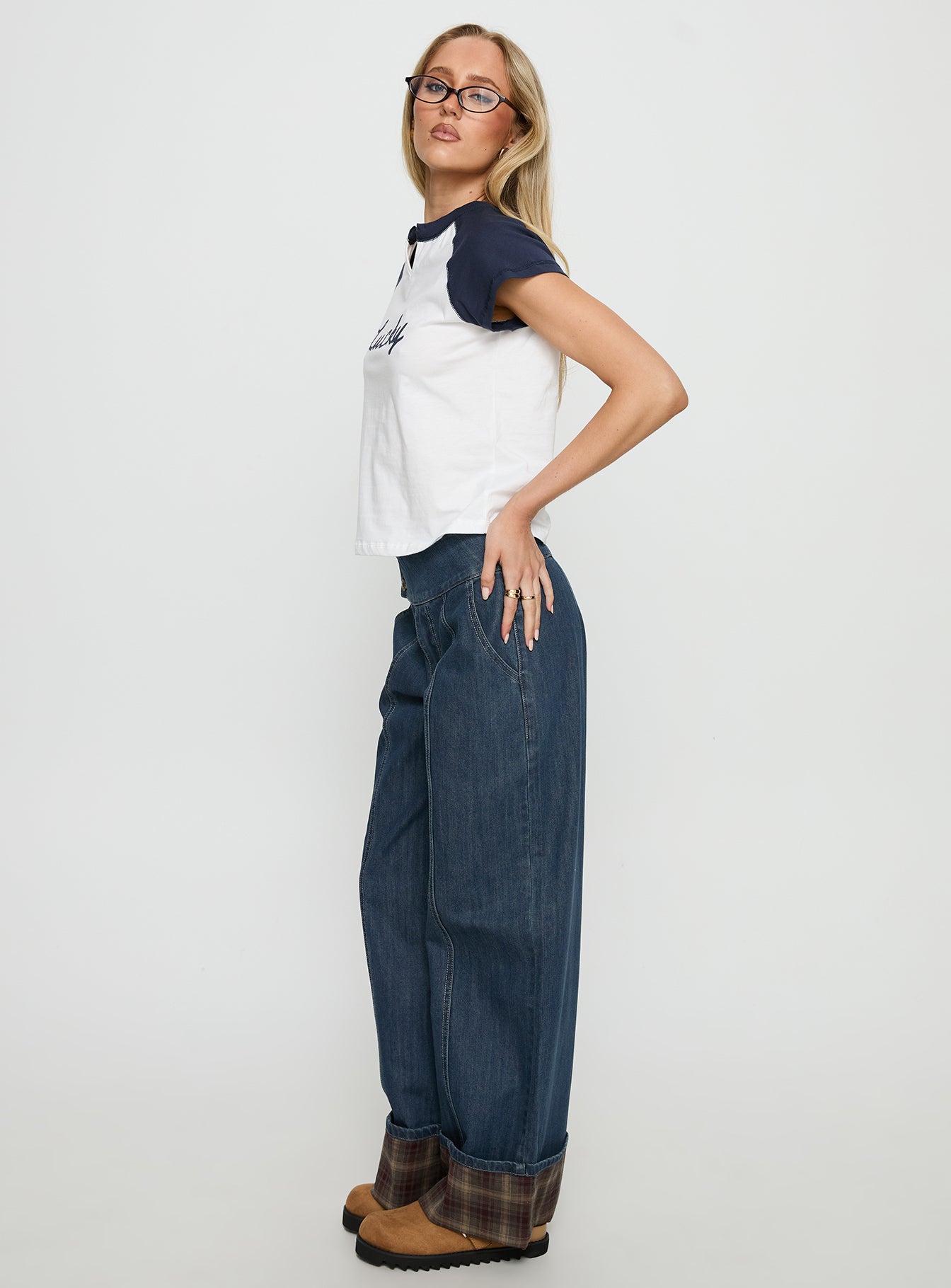 side view of model wearing Princess Polly Nikoletta Foldover Jeans Dark Wash / Check Mid Rise Jeans 