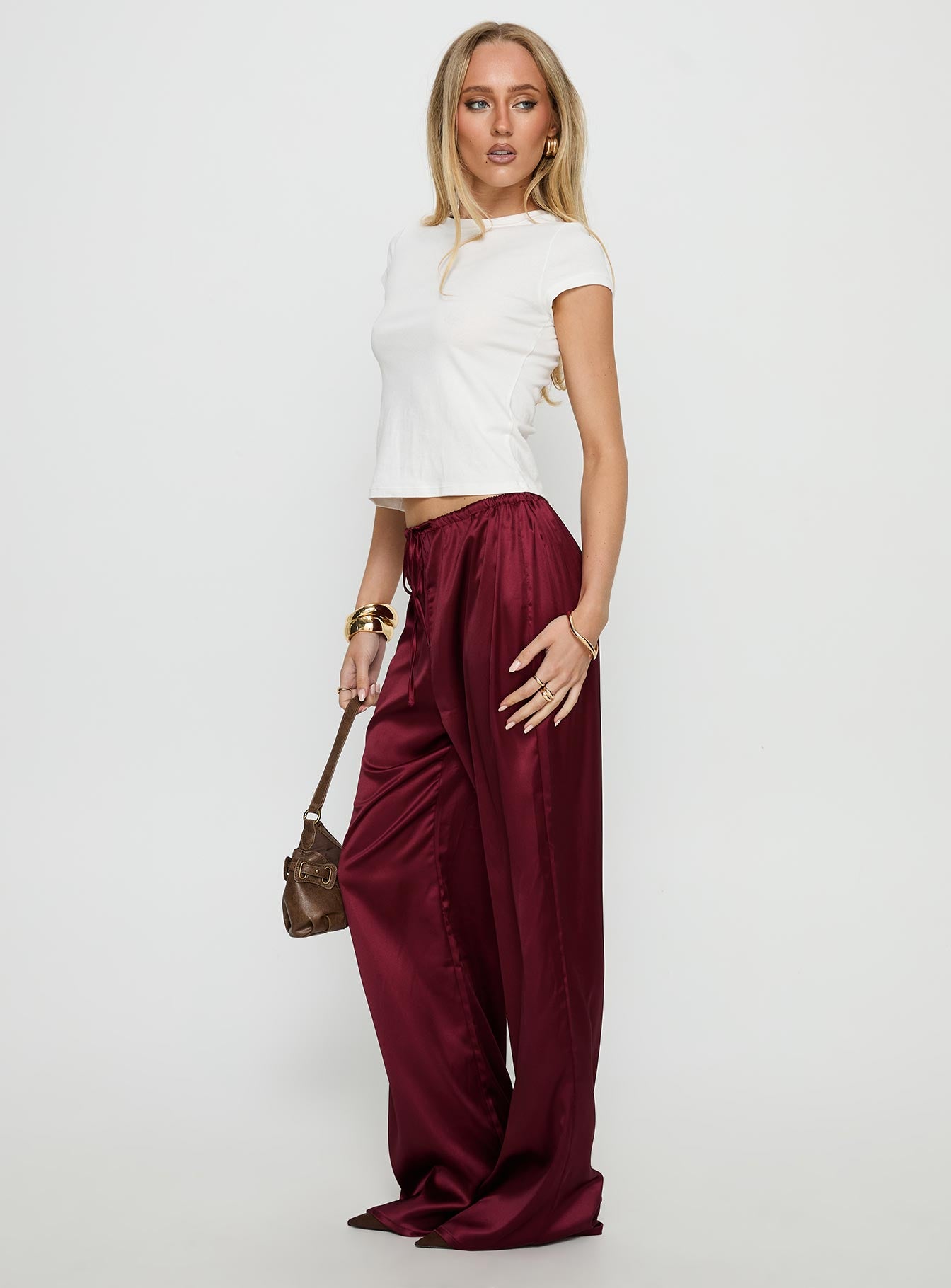 front view of model wearing Princess Polly Soulstar Satin Pants Wine Mid Rise Pants 