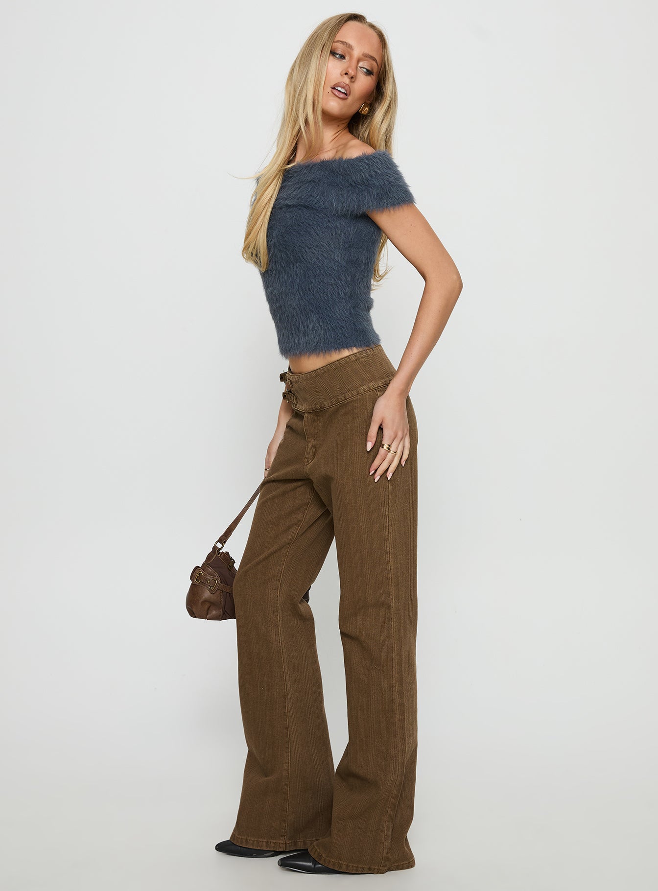 side view of model wearing Princess Polly Thrill Ride Mid Rise Corduroy Flare Jeans Washed Brown Mid Rise Jeans 