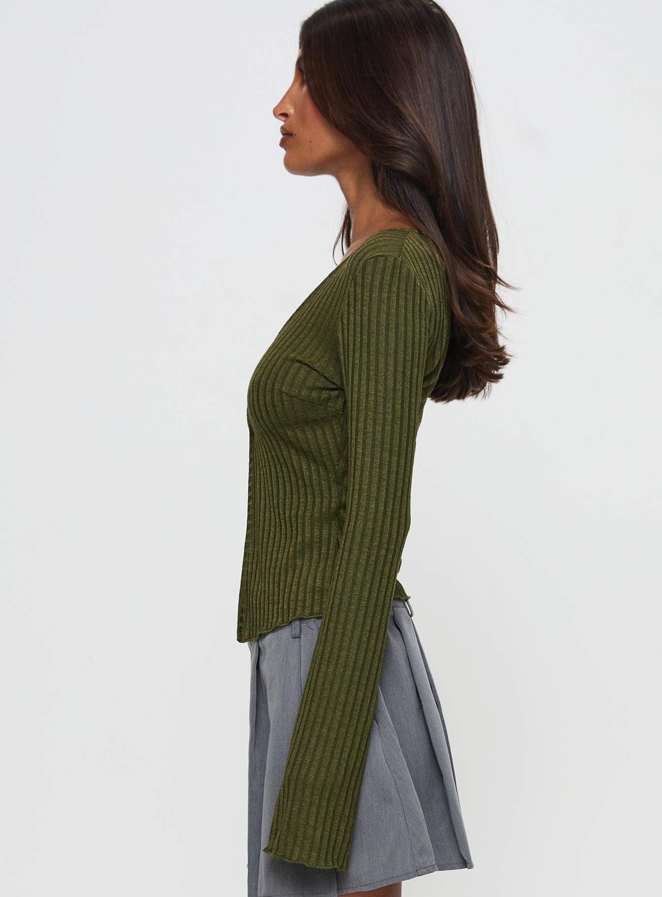 side view of model wearing Princess Polly Allona Long Sleeve Top Green Full Sleeves Plunger 
