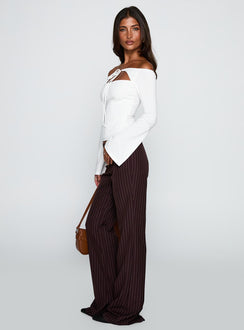 side view of model wearing Princess Polly Kinkirk Flared Pants Brown Pinstripe Low Rise Pants 