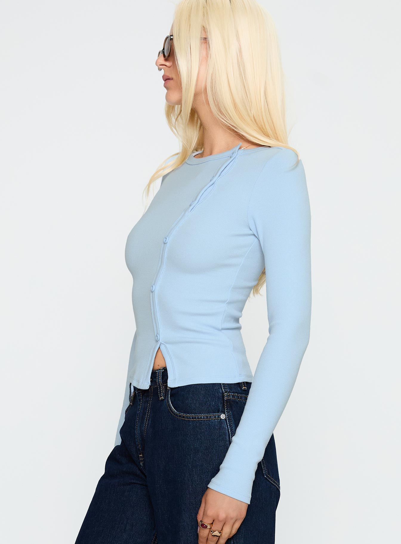 side view of model wearing Princess Polly Passoni Long Sleeve Top Blue Full Sleeves Crew Neck 
