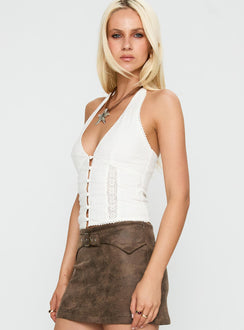 side view of model wearing Princess Polly Vayda Halter Top White Sleeveless Plunger 