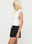 side view of model wearing Princess Polly Snooze Satin Boxer Short Black High Waisted Shorts 