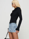   side view of model wearing Princess Polly Pacific Coast Denim Cargo Skirt Light Wash Mini Skirts 