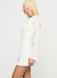 side view of model wearing Princess Polly Lukea Lace Long Sleeve Mini Dress Cream Boat Neck 