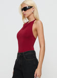 side view of model wearing Princess Polly Imposter Bodysuit Cherry Red Sleeveless 