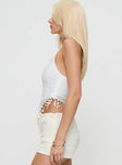 side view of model wearing Princess Polly Isolene Top White Sleeveless Crew Neck 