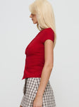 side view of model wearing Princess Polly Calyssa Top Red Short Sleeves Crew Neck 