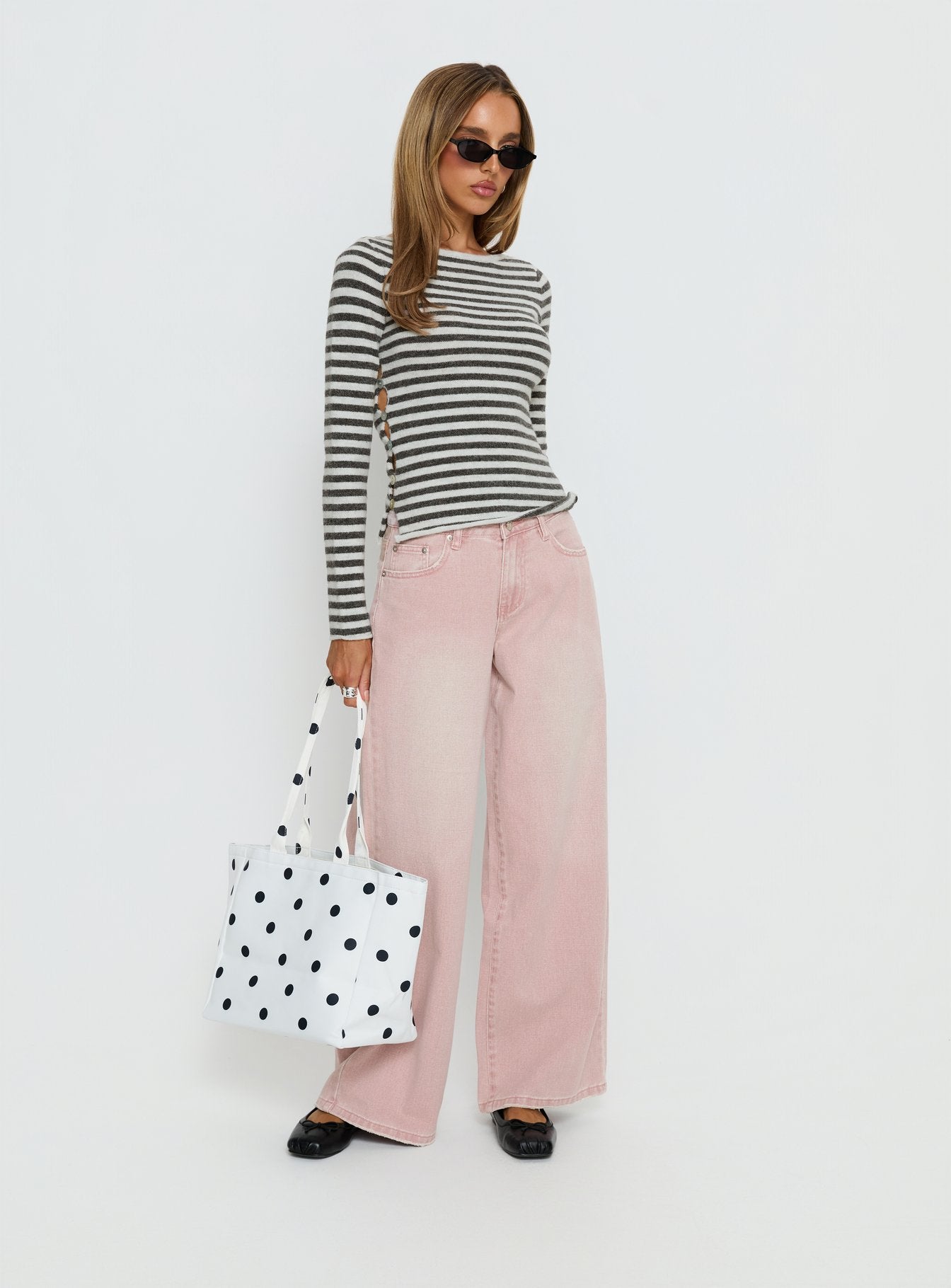 side view of model wearing Princess Polly Lucky Dip Mid Rise Straight Leg Jeans Washed Pink Mid Rise Jeans 