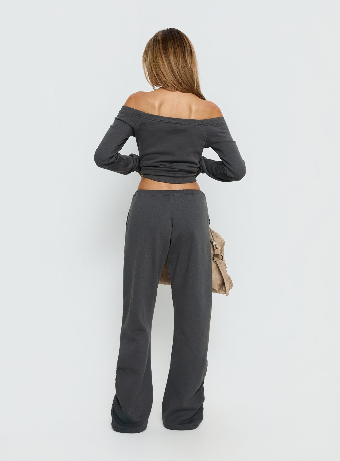 back view of model wearing Princess Polly Rylan Low Rise Joggers Grey Low Rise Pants 
