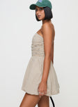 side view of model wearing Princess Polly Quinette Strapless Bubble Hem Mini Dress Beige Stripe Straight Neck 