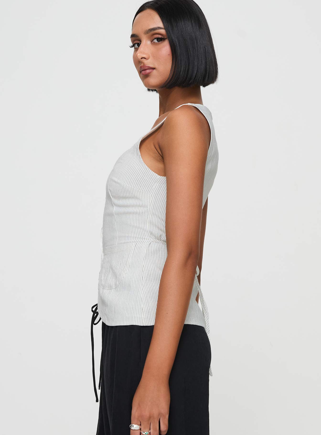 side view of model wearing Princess Polly Spirito Vest Top White Thin Stripe Sleeveless Square Neck 