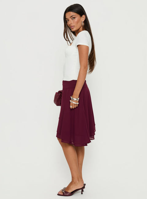   side view of model wearing Princess Polly Evanescence Asymmetrical Midi Skirt Cherry 