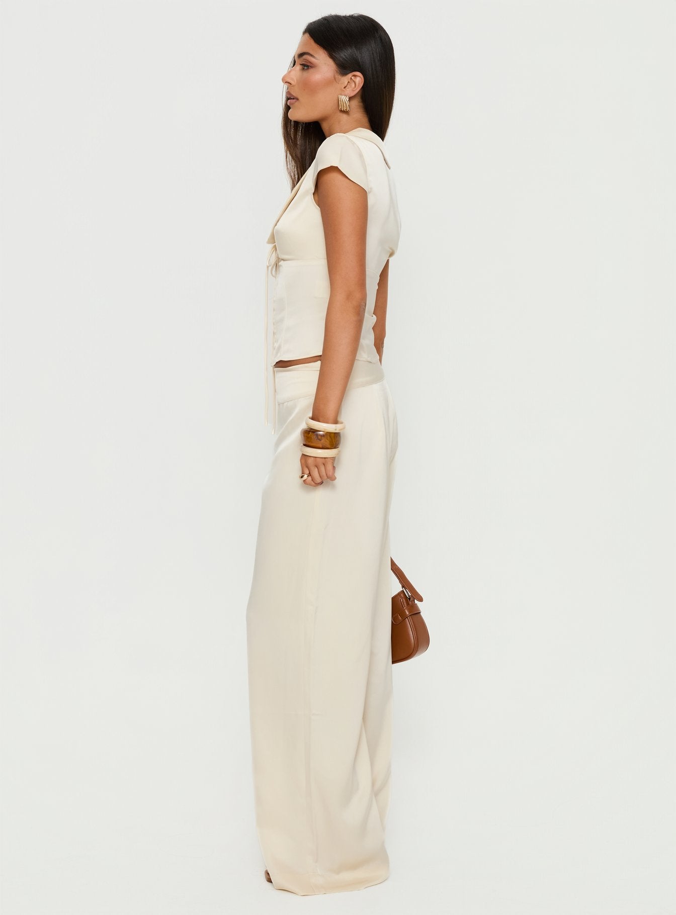 side view of model wearing Princess Polly Aubrette Satin Tie Pants Cream High Rise Pants 