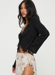 Long sleeve top  Flared sleeves, lace trim detail, open front design  Three tie fastenings at front 