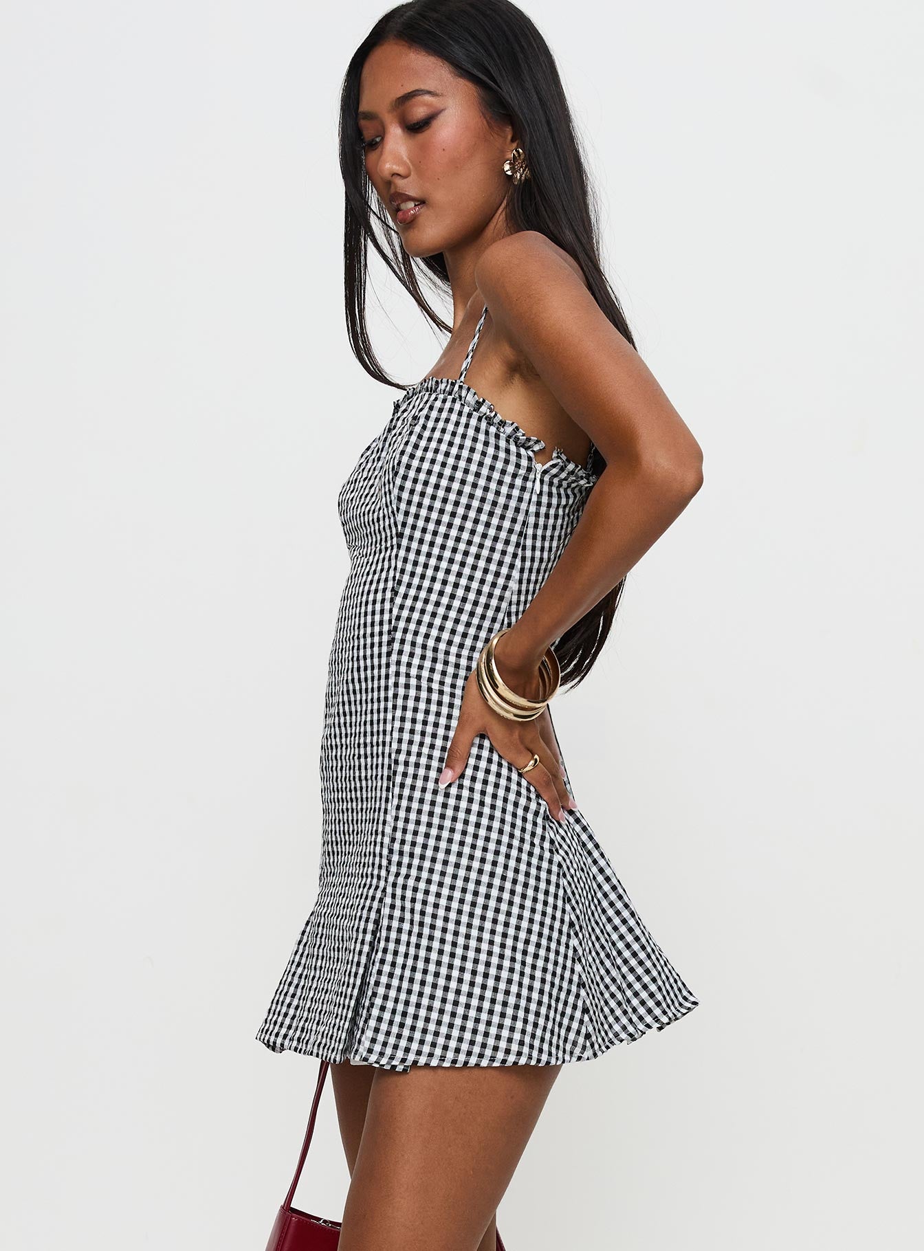 side view of model wearing Princess Polly Bessette Mini Dress Black Gingham Square Neck 