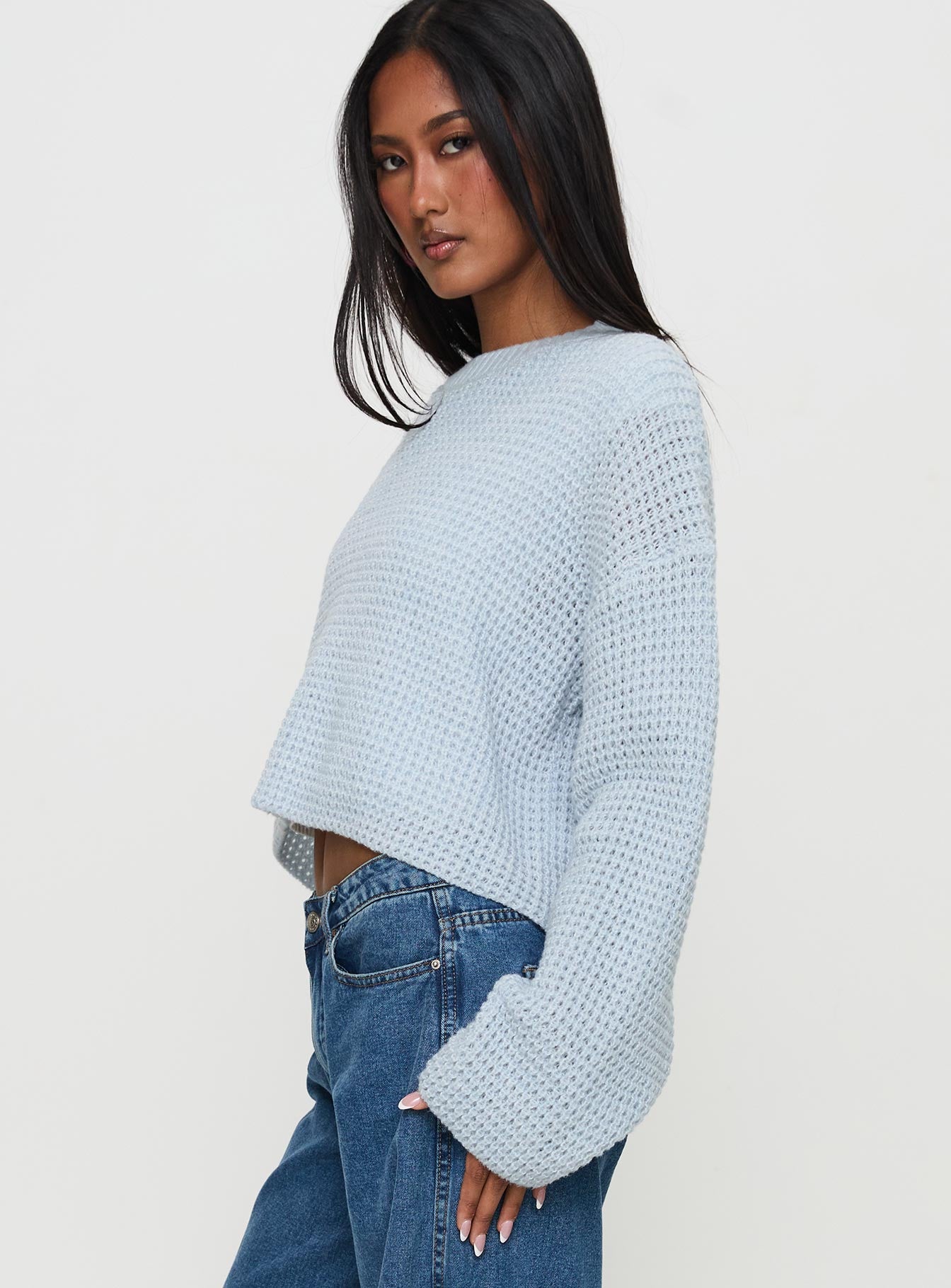 side view of model wearing Princess Polly Elinda Knit Sweater Blue Cropped 