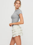 side view of model wearing Princess Polly Match Point Mini Skort Porcelain Low Rise Shorts 