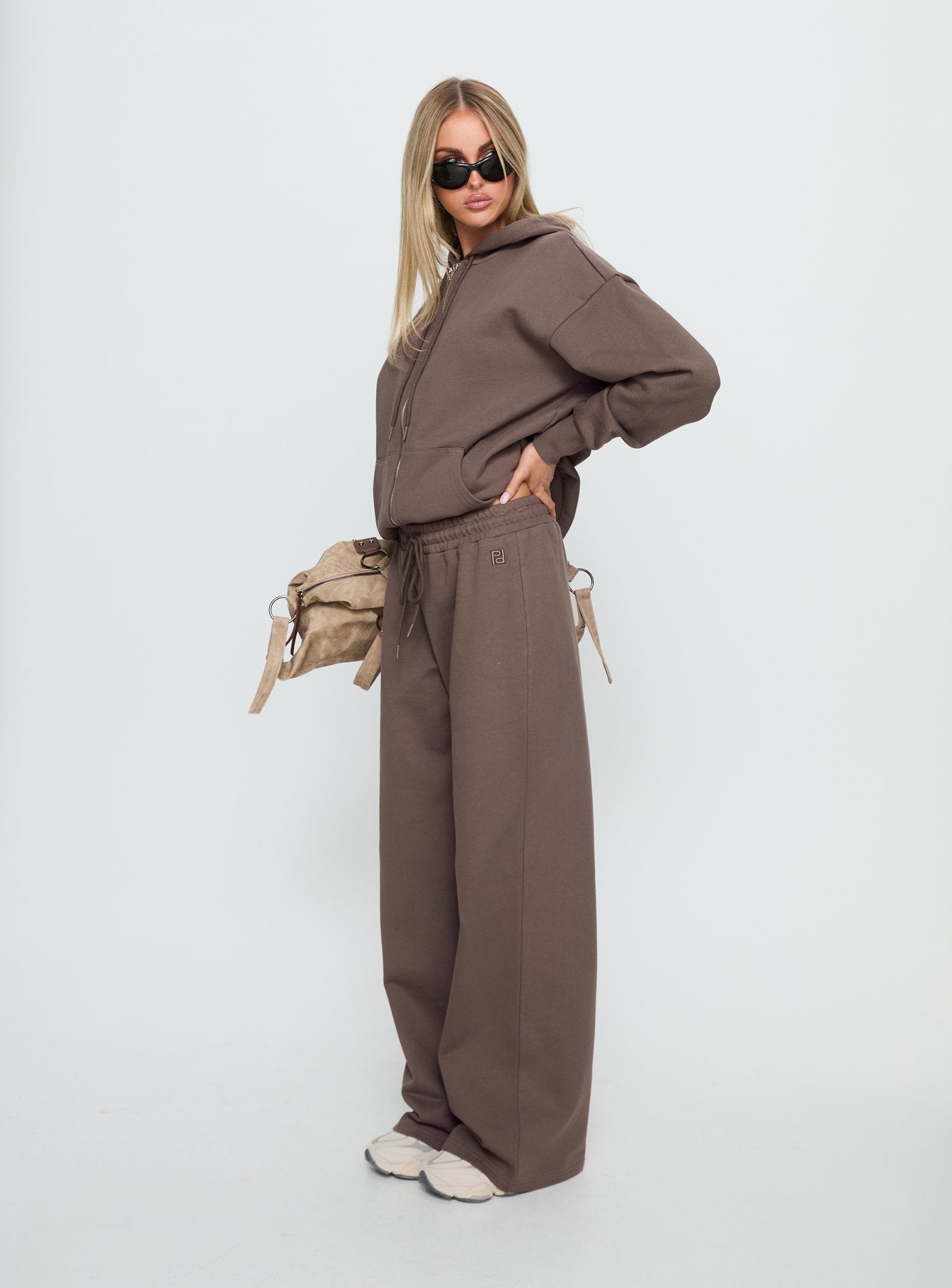 side view of model wearing Princess Polly All Day Straight Leg Sweatpants Mocha Mid Rise Pants 