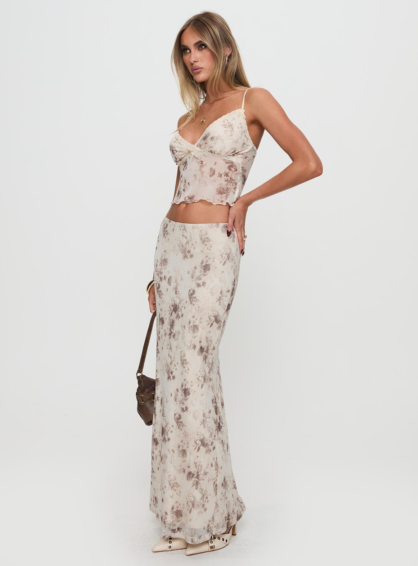   side view of model wearing Princess Polly Shepherd Maxi Skirt Floral Multi Maxi 
