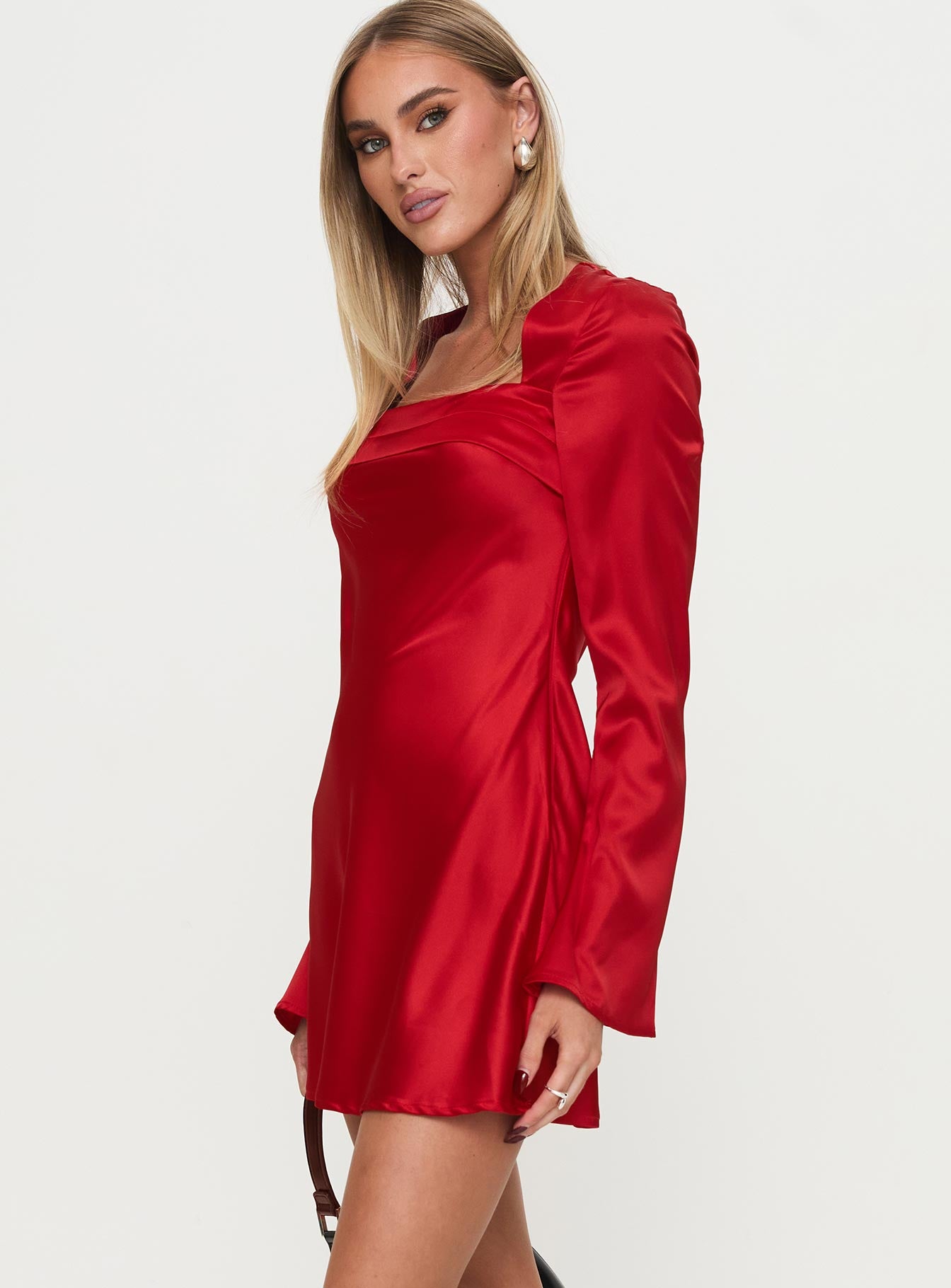side view of model wearing Princess Polly Phillipa Long Sleeve Mini Dress Red Square Neck 