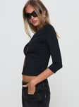 side view of model wearing Princess Polly Giabella 3/4 Sleeve Top Black Full Sleeves Crew Neck 