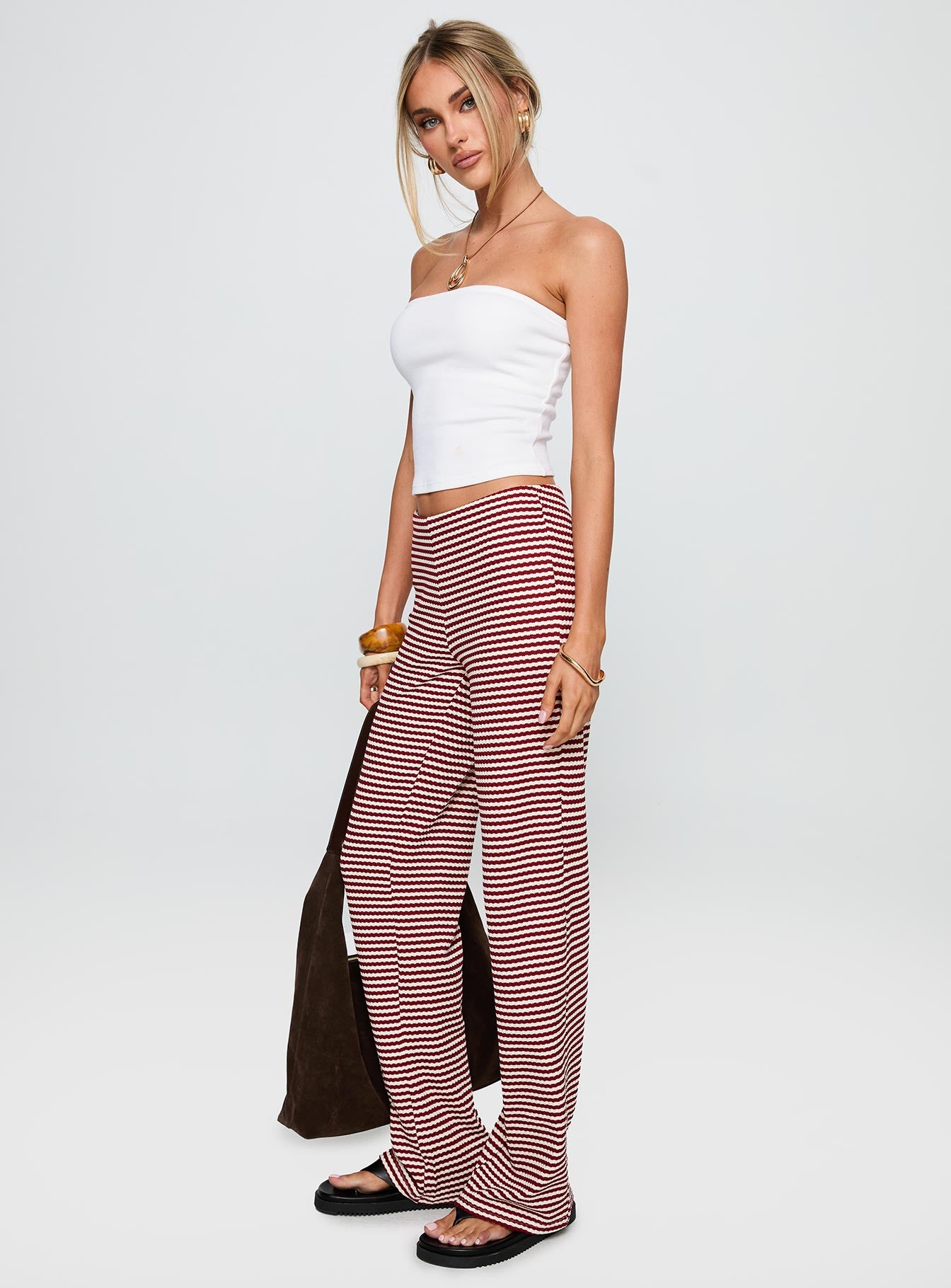 side view of model wearing Princess Polly Next To Me Lounge Pant Red / White Stripe Low Rise Pants 