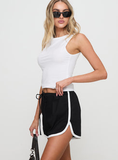 side view of model wearing Princess Polly Tyrah Shorts Black High Waisted Shorts 